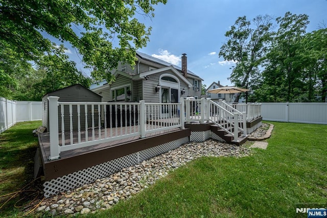 20 Card St, Hamburg, NJ 07419 - back of house with a chimney, a wooden deck, and a fenced backyard