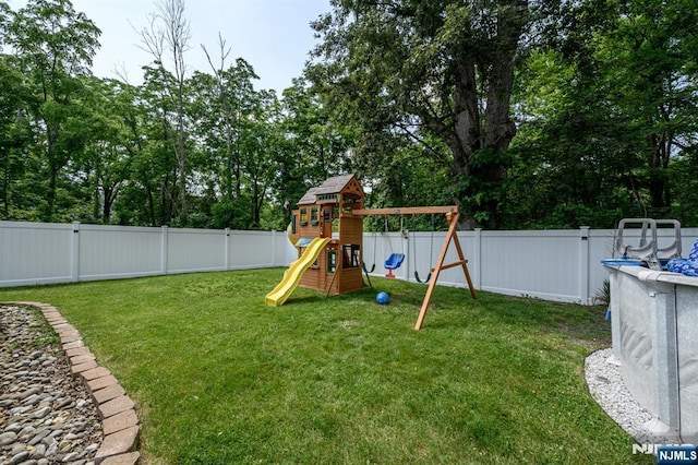 20 Card St, Hamburg, NJ 07419 - fenced backyard with a playground