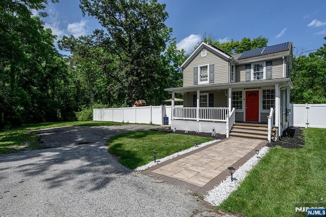 20 Card St, Hamburg, NJ 07419 - view of front of house with a porch, roof mounted solar panels, and a gate