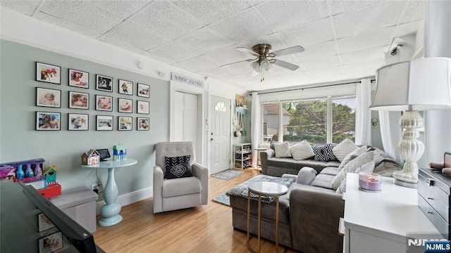 80 Union Ave, Little Ferry, NJ 07643 - living room featuring light wood-style floors, ceiling fan, and a paneled ceiling