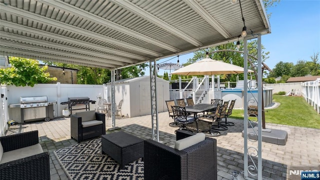 80 Union Ave, Little Ferry, NJ 07643 - fenced backyard with a shed, a patio area, area for grilling, outdoor dining space, and an outdoor hangout area