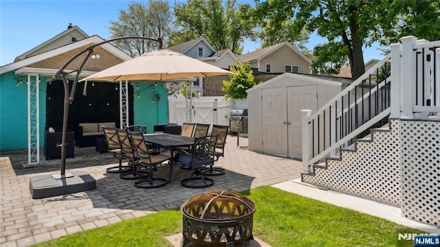 80 Union Ave, Little Ferry, NJ 07643 - view of patio featuring a shed, grilling area, a gate, outdoor dining space, and stairs