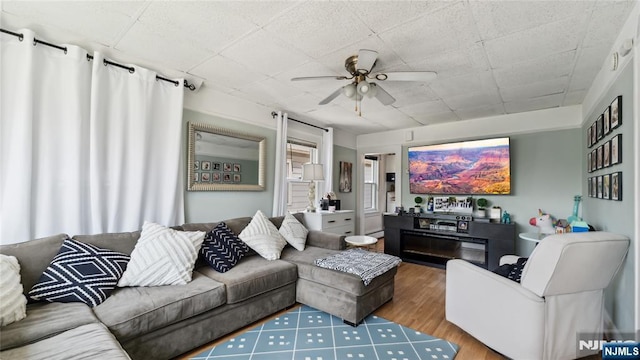 80 Union Ave, Little Ferry, NJ 07643 - living room featuring ceiling fan, wood finished floors, and a baseboard heating unit
