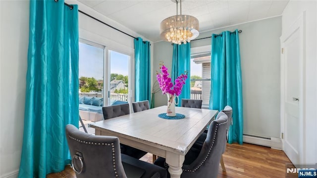 80 Union Ave, Little Ferry, NJ 07643 - dining area with a chandelier, baseboard heating, and wood finished floors