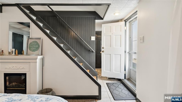 80 Union Ave, Little Ferry, NJ 07643 - stairway featuring tile patterned flooring and a glass covered fireplace