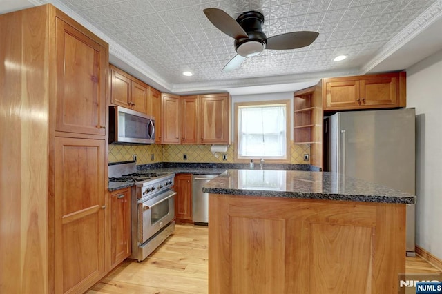 14 N Railroad Ave, Mahwah, NJ 07430 - kitchen featuring stainless steel appliances, an ornate ceiling, a kitchen island, tasteful backsplash, and light wood-style floors