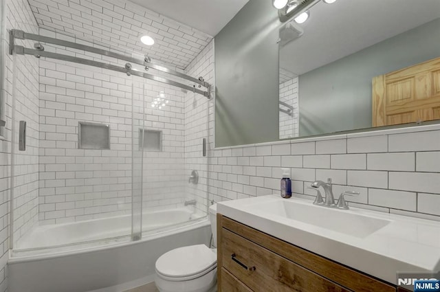 14 N Railroad Ave, Mahwah, NJ 07430 - full bathroom with vanity, enclosed tub / shower combo, tile walls, and decorative backsplash