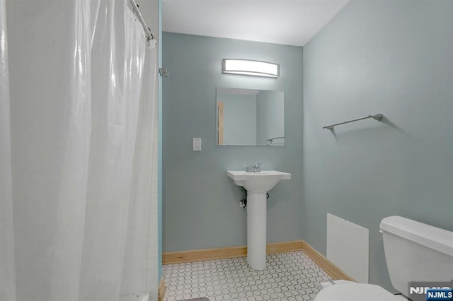 14 N Railroad Ave, Mahwah, NJ 07430 - bathroom featuring curtained shower and tile patterned floors