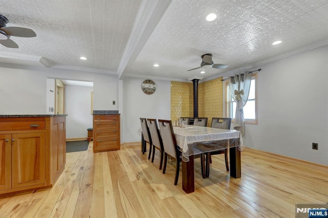 14 N Railroad Ave, Mahwah, NJ 07430 - dining space featuring ceiling fan, a wood stove, light wood-type flooring, crown molding, and recessed lighting