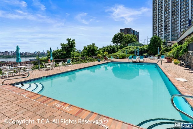 300 Gorge Rd Unit 1, Cliffside Park, NJ 07010 - community pool with a water view and a patio area