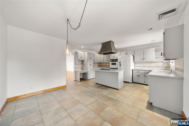 300 Gorge Rd Unit 1, Cliffside Park, NJ 07010 - kitchen with white appliances, open shelves, backsplash, island exhaust hood, and light countertops