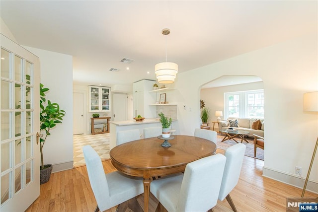 146 Raab Ave, Bloomfield, NJ 07003 - dining space featuring arched walkways and light wood finished floors
