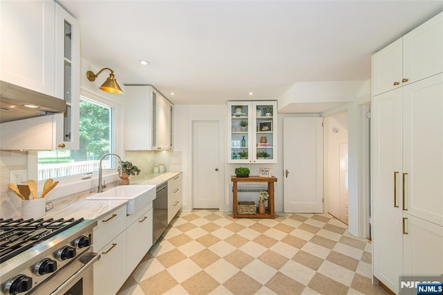 146 Raab Ave, Bloomfield, NJ 07003 - kitchen featuring appliances with stainless steel finishes, white cabinetry, glass insert cabinets, and backsplash