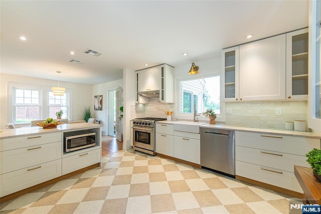146 Raab Ave, Bloomfield, NJ 07003 - kitchen featuring appliances with stainless steel finishes, healthy amount of natural light, light countertops, and recessed lighting