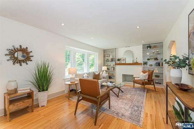 146 Raab Ave, Bloomfield, NJ 07003 - living area with light wood-style floors, recessed lighting, a fireplace, and built in features