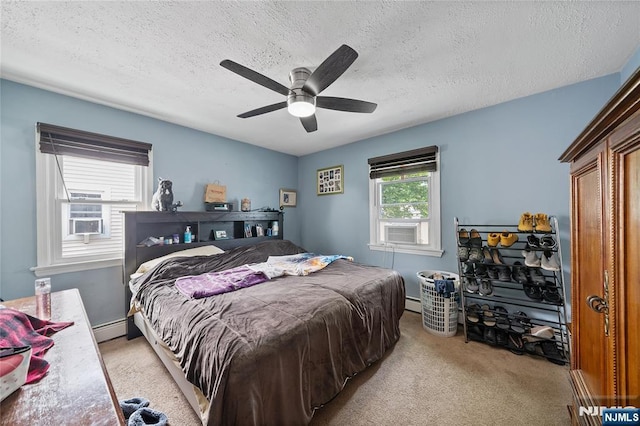 67 6th Ave, Passaic, NJ 07055 - bedroom with a textured ceiling, carpet flooring, a baseboard heating unit, cooling unit, and a ceiling fan