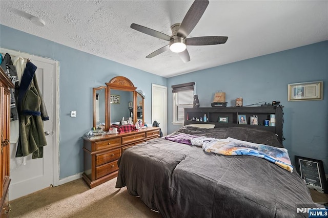 67 6th Ave, Passaic, NJ 07055 - bedroom with carpet floors, ceiling fan, and a textured ceiling