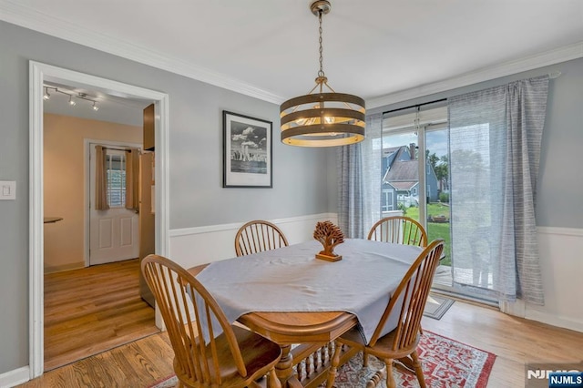 116 Springfield Ave, Hasbrouck Heights, NJ 07604 - dining room featuring a chandelier, track lighting, light wood-style floors, and crown molding