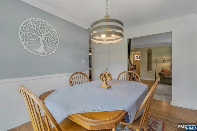 116 Springfield Ave, Hasbrouck Heights, NJ 07604 - dining space featuring wood finished floors, crown molding, and stairway