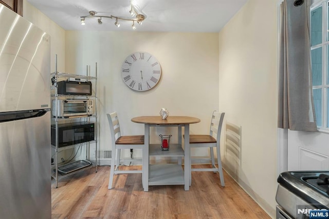 116 Springfield Ave, Hasbrouck Heights, NJ 07604 - dining space featuring wood finished floors and baseboards