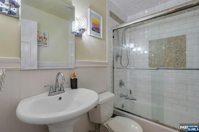 116 Springfield Ave, Hasbrouck Heights, NJ 07604 - bathroom featuring enclosed tub / shower combo and a wainscoted wall