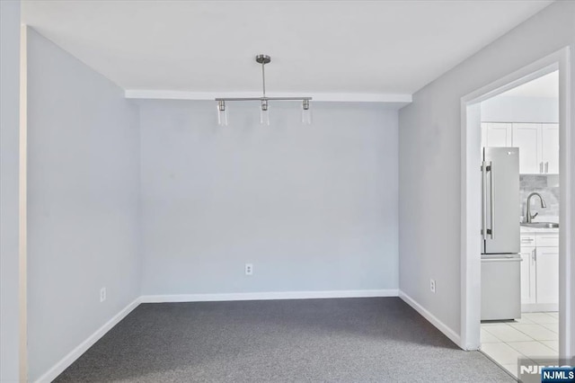 412-432 Broadway Unit 25A, Passaic, NJ 07055 - unfurnished dining area featuring a sink and light colored carpet