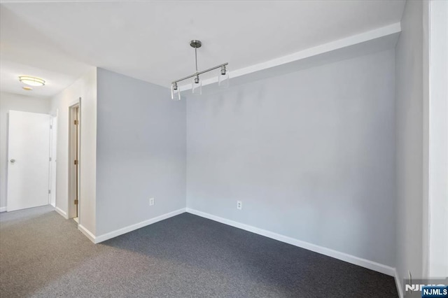 412-432 Broadway Unit 25A, Passaic, NJ 07055 - empty room featuring baseboards and dark colored carpet