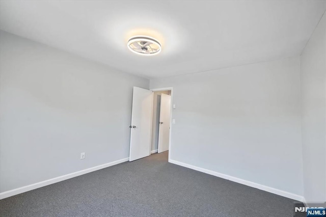 412-432 Broadway Unit 25A, Passaic, NJ 07055 - unfurnished room featuring dark colored carpet and baseboards