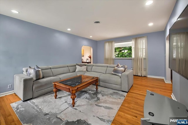 915 Glen Ave, Twp Of Washington, NJ 07676 - living room with arched walkways, wood finished floors, and recessed lighting