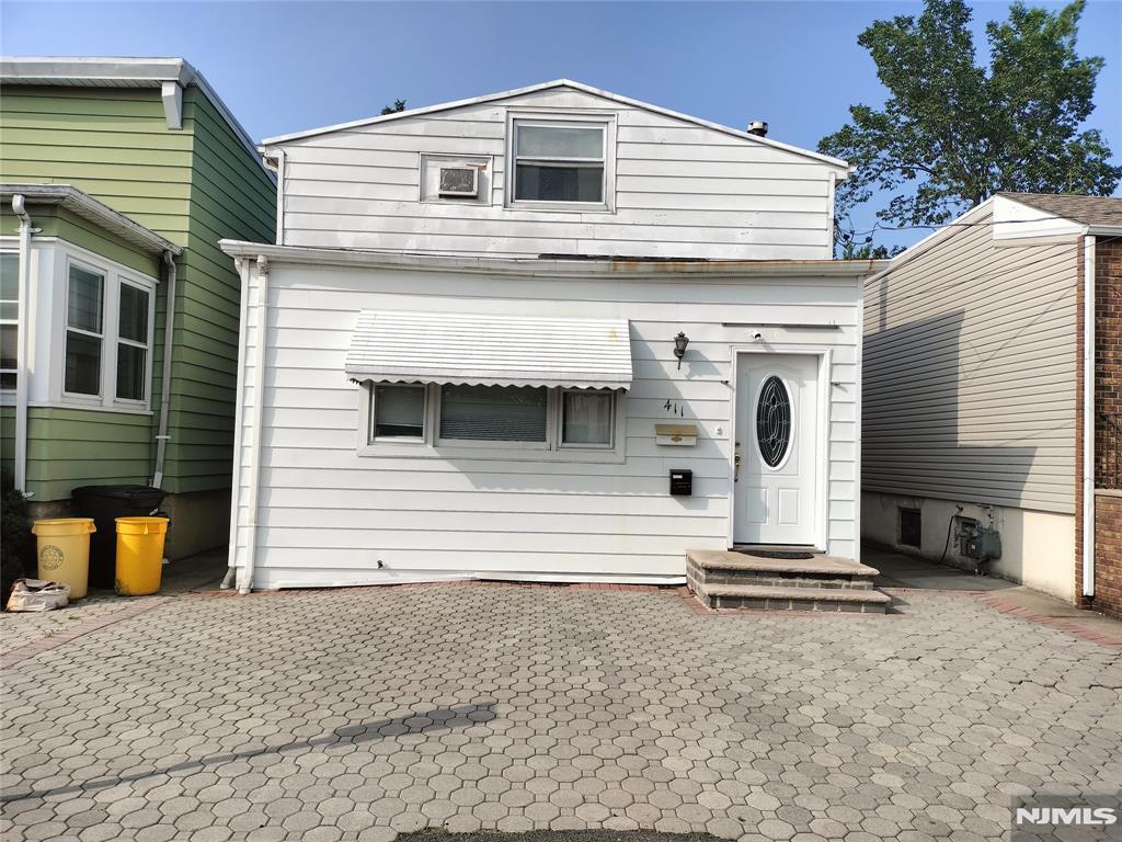 411 Sheridan Pl, Fairview, NJ 07022 - view of front of home with a patio area