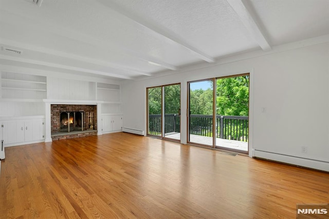 34 Tintle Rd, Kinnelon Borough, NJ 07405 - unfurnished living room with a baseboard radiator, beam ceiling, wood finished floors, a textured ceiling, and a lit fireplace