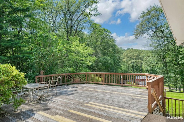 34 Tintle Rd, Kinnelon Borough, NJ 07405 - wooden terrace with outdoor dining area and a wooded view