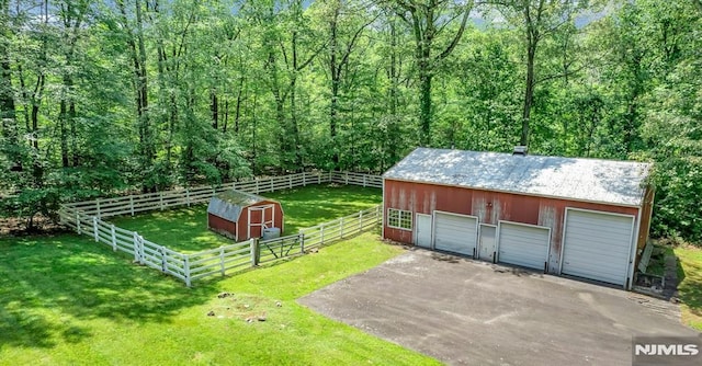 34 Tintle Rd, Kinnelon Borough, NJ 07405 - view of yard featuring an outbuilding and a garage