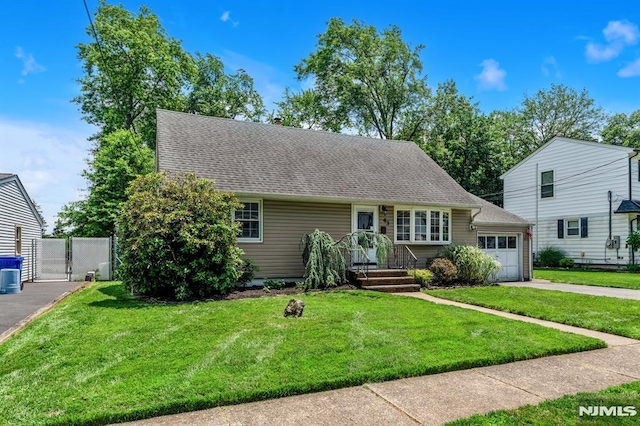 43 Barnert Ave, Totowa, NJ 07512 - view of front of house featuring driveway, an attached garage, a gate, and roof with shingles