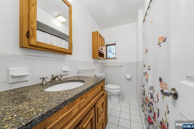 434 3rd Ave, Lyndhurst, NJ 07071 - full bathroom with tile patterned flooring, tile walls, vanity, wainscoting, and curtained shower