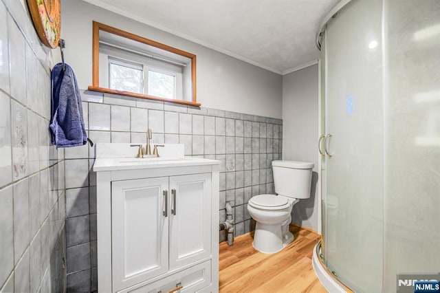 434 3rd Ave, Lyndhurst, NJ 07071 - bathroom featuring tile walls, wood finished floors, a shower stall, vanity, and ornamental molding