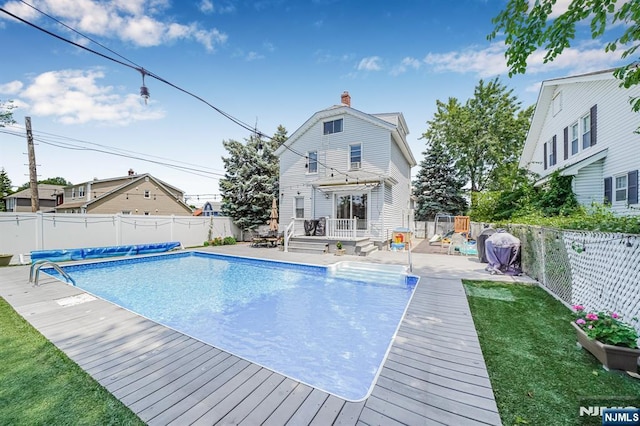 434 3rd Ave, Lyndhurst, NJ 07071 - view of pool with a deck and a fenced backyard