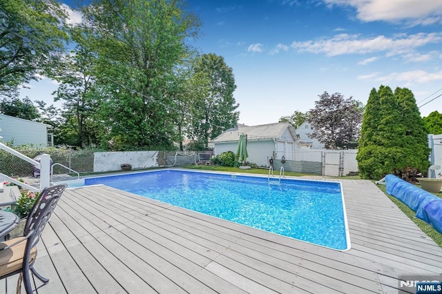 434 3rd Ave, Lyndhurst, NJ 07071 - view of swimming pool with a wooden deck and a fenced backyard