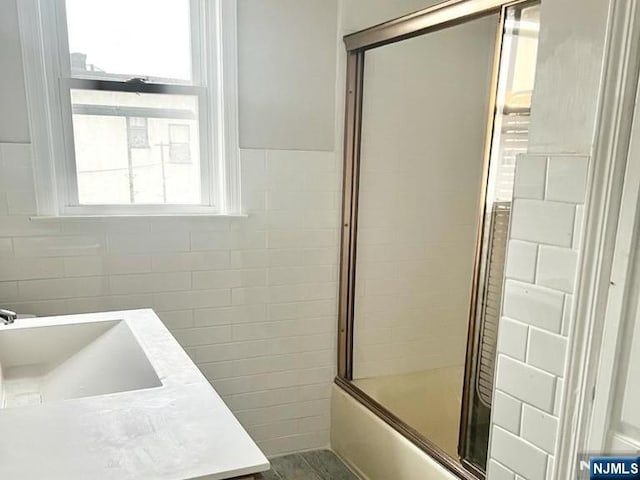 137 Prospect St, Lodi, NJ 07644 - full bath featuring vanity and enclosed tub / shower combo