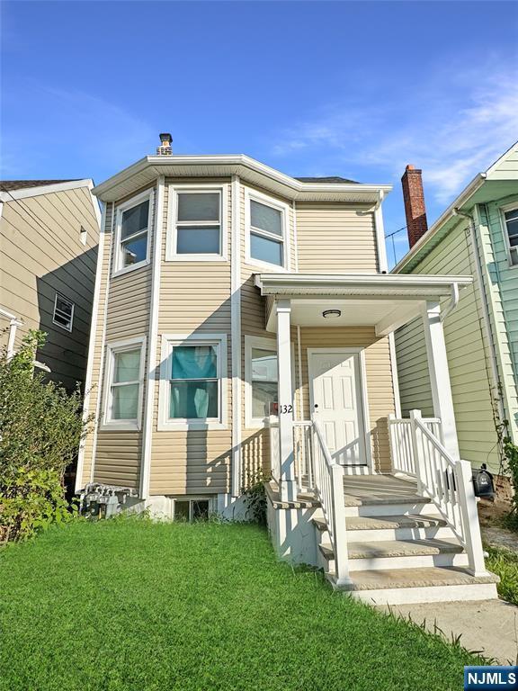 132 Lincoln Ave, Orange, NJ 07050 - view of front of property with a front yard
