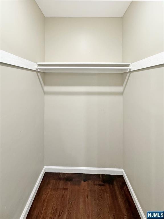 132 Lincoln Ave, Orange, NJ 07050 - walk in closet featuring wood finished floors