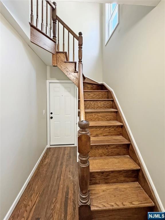 132 Lincoln Ave, Orange, NJ 07050 - staircase featuring wood finished floors and a high ceiling