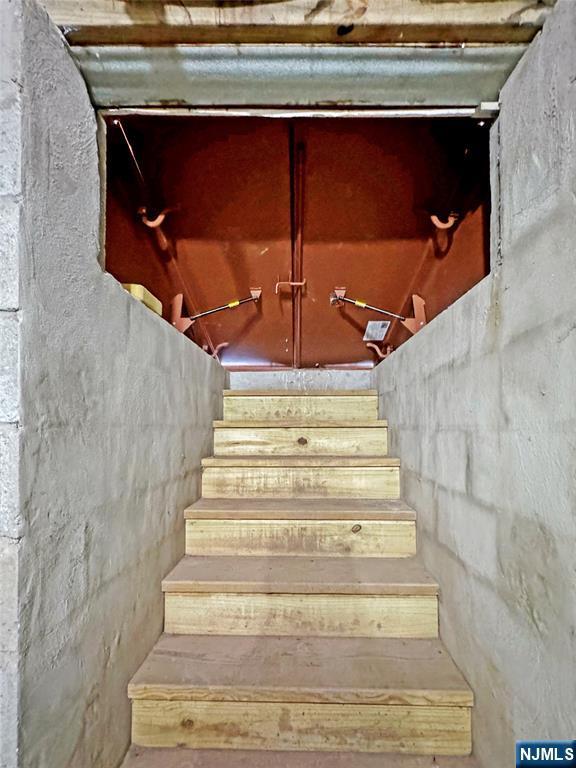 132 Lincoln Ave, Orange, NJ 07050 - stairway with lofted ceiling