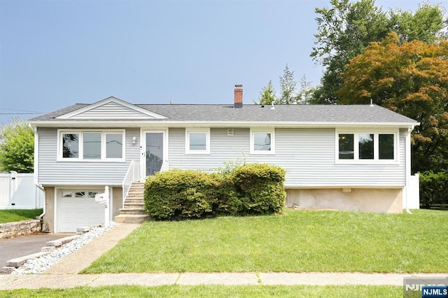 8 Cedar Rd, Dumont, NJ 07628 - ranch-style home with a chimney, an attached garage, driveway, and a shingled roof