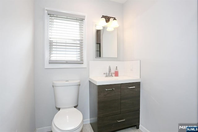 8 Cedar Rd, Dumont, NJ 07628 - half bath featuring vanity and tasteful backsplash