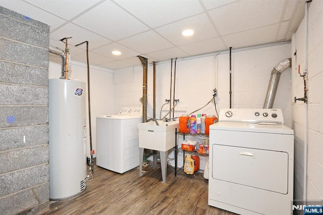 8 Cedar Rd, Dumont, NJ 07628 - laundry room featuring gas water heater, separate washer and dryer, wood finished floors, concrete block wall, and recessed lighting