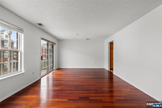 53 Marrow St Unit 2605, Newark, NJ 07103 - spare room with plenty of natural light, a textured ceiling, and wood finished floors