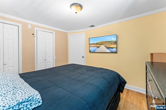 837 Keep St, Linden, NJ 07036 - bedroom with light wood-style flooring and crown molding
