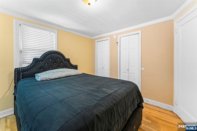 837 Keep St, Linden, NJ 07036 - bedroom with two closets, wood finished floors, and ornamental molding