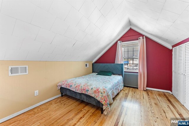 837 Keep St, Linden, NJ 07036 - bedroom with hardwood / wood-style floors, radiator heating unit, and vaulted ceiling